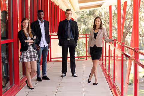 Business students standing on balcony