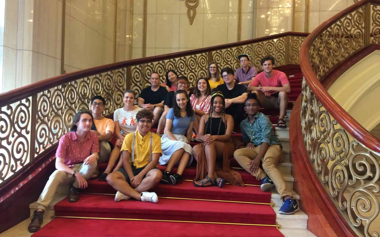 Chen and her students on stairs