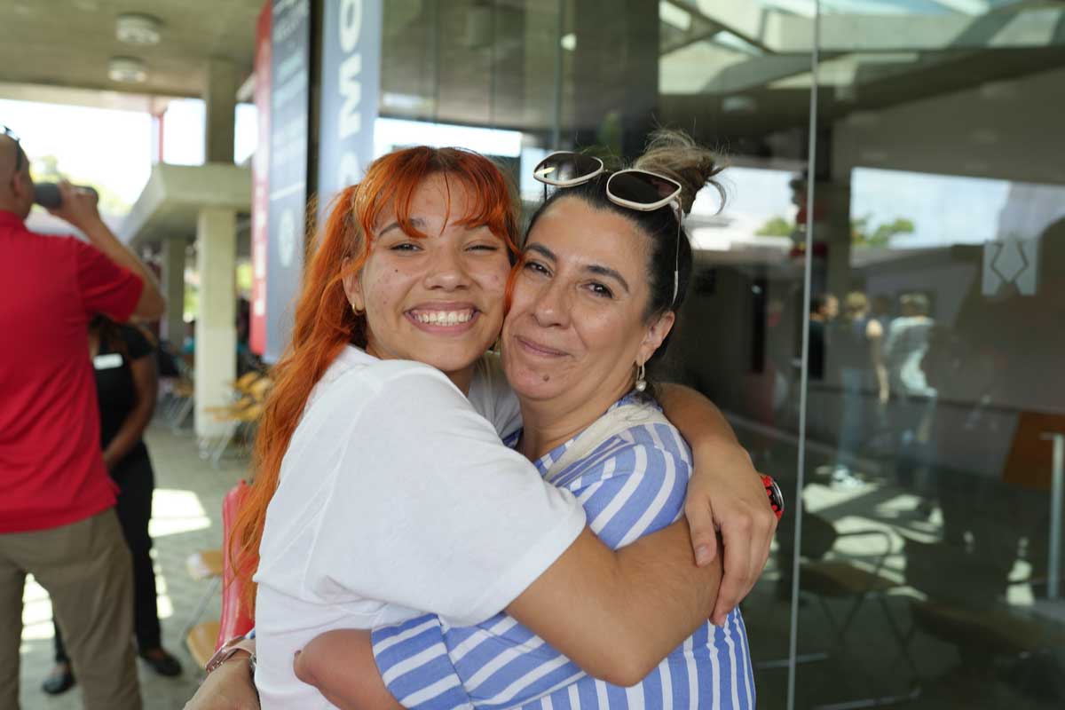 a mom and child hugging