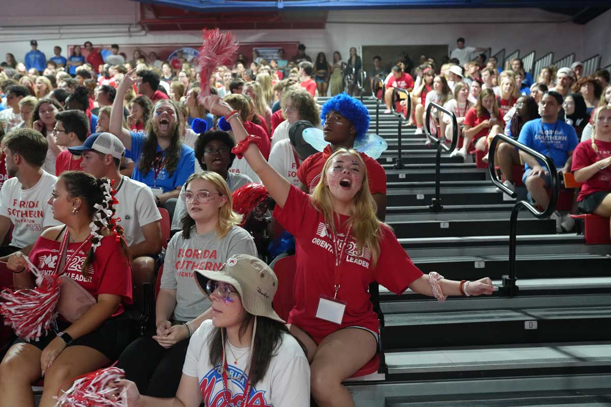 student cheering at pep rally