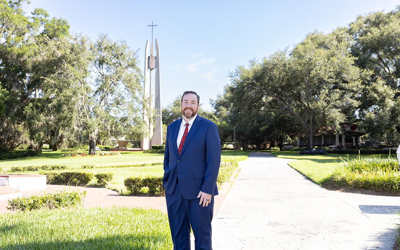 Dr. Martin stands outside