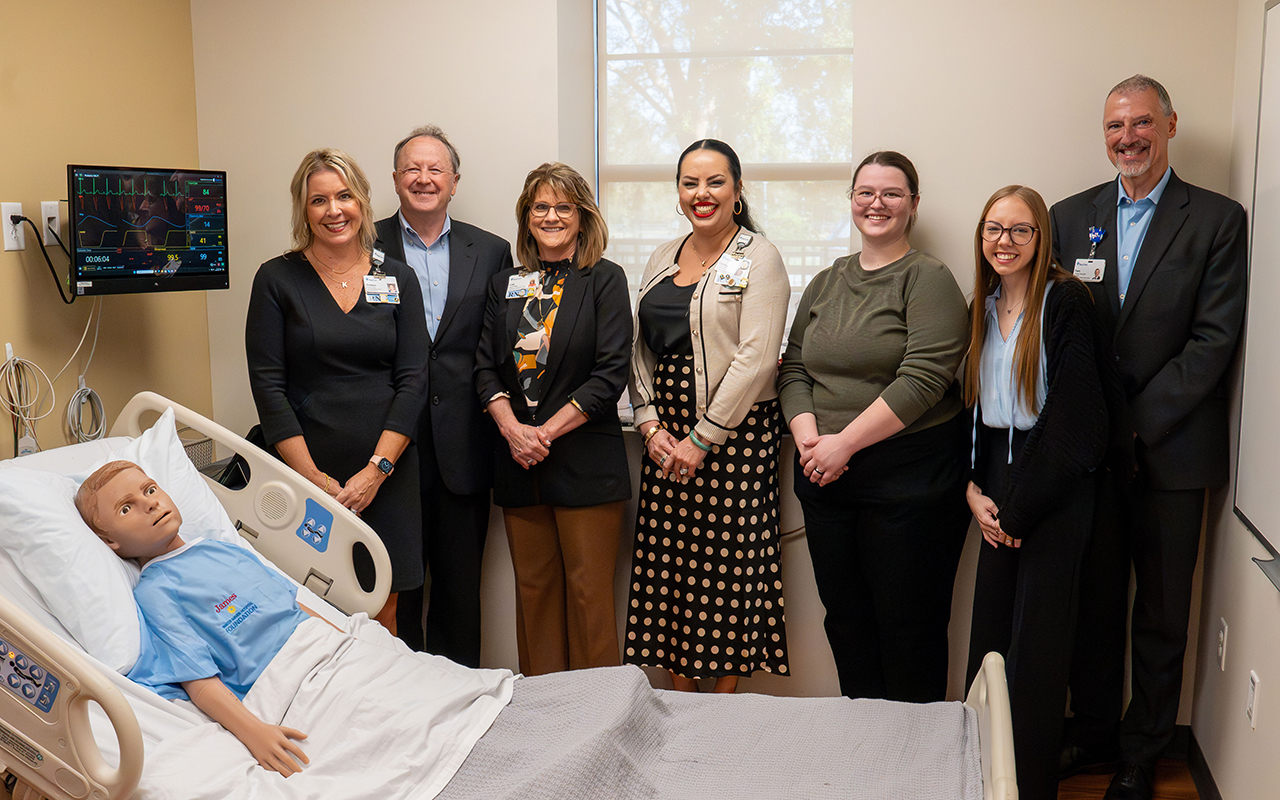 Nursing leaders with hospital bed