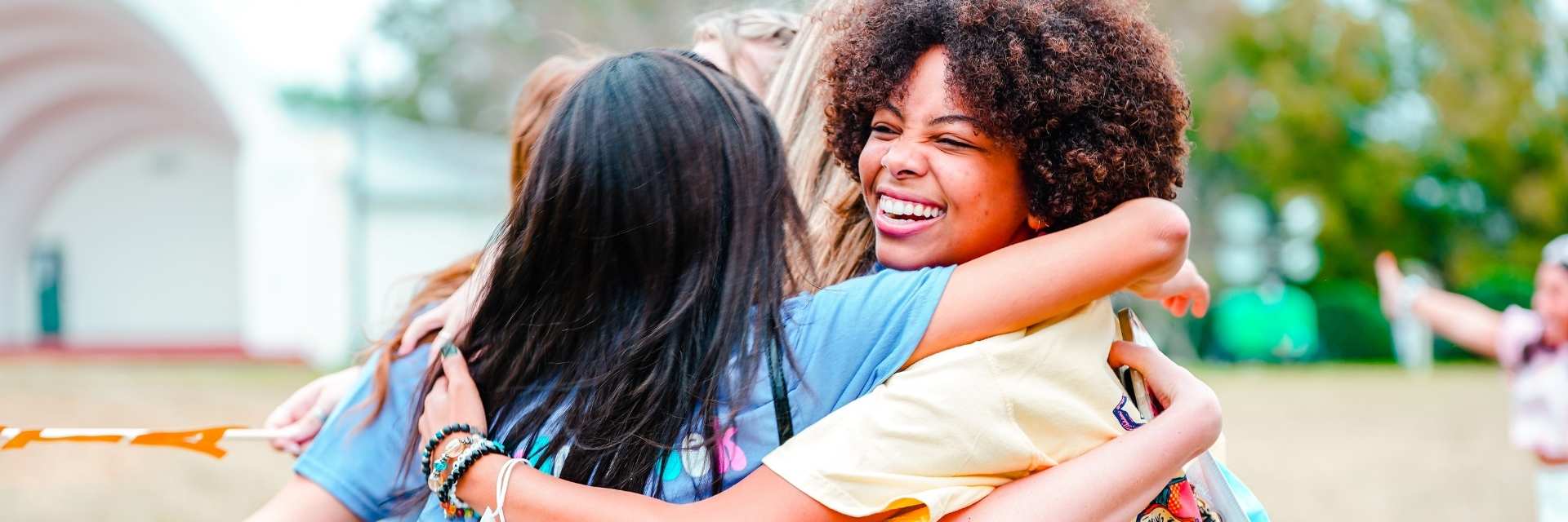 students hugging
