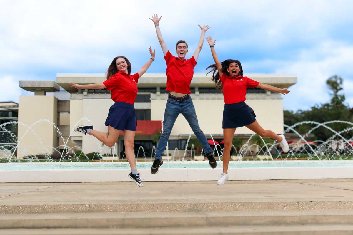 students jumping at the water dome