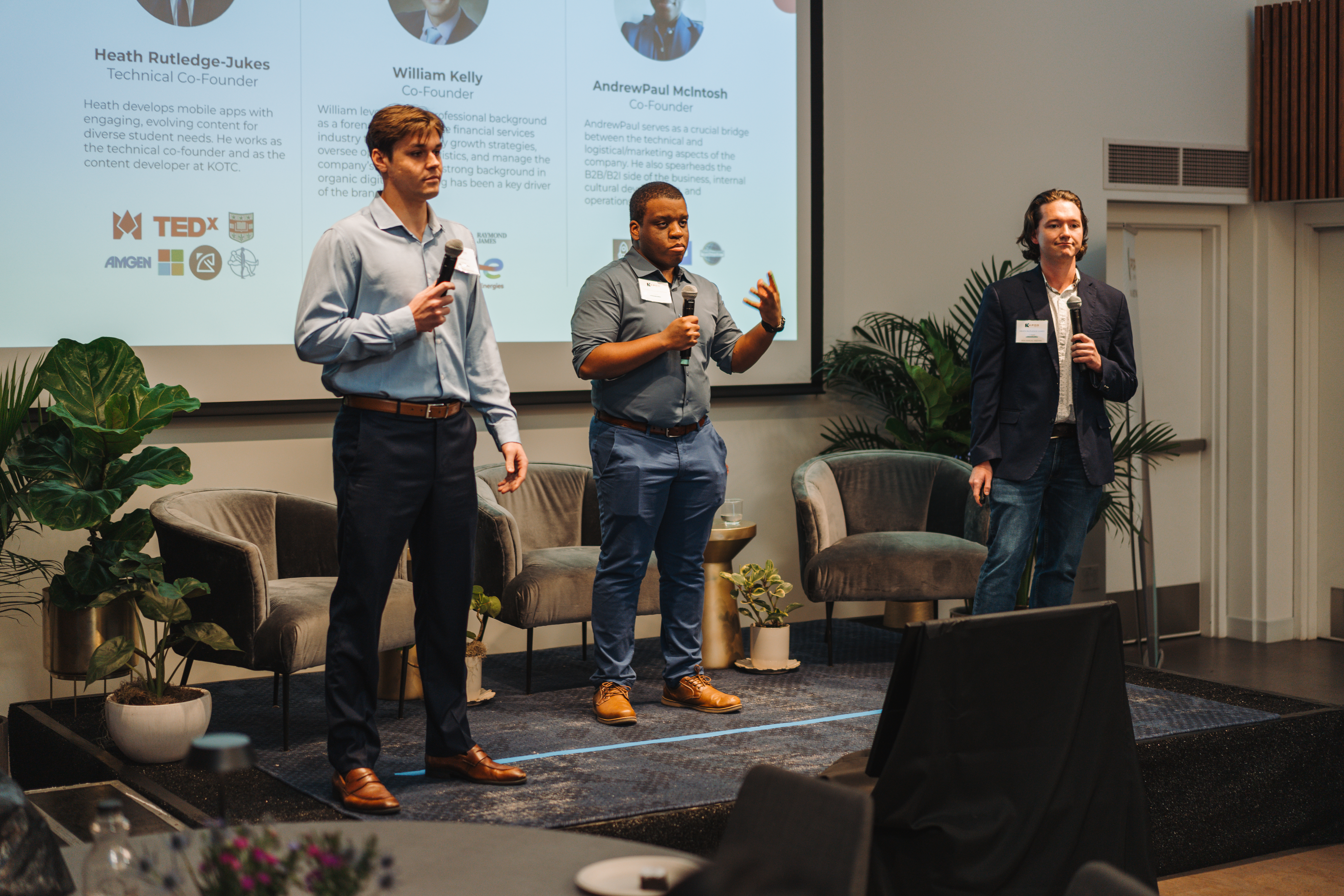 the alumni speaking on stage