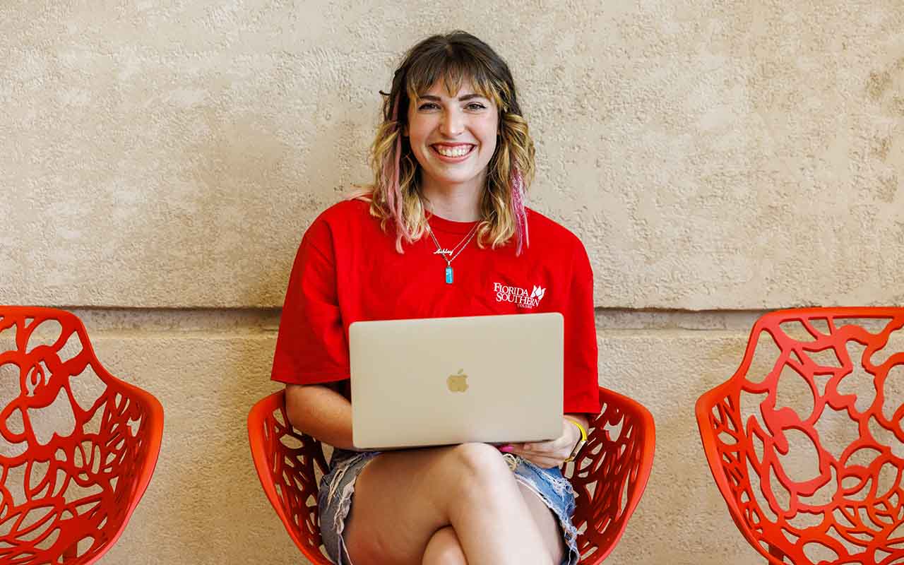 student with computer