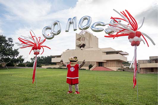 Mocsie with Go Mocs balloons