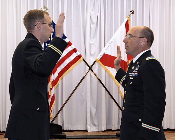 Captain Cody Khork taking an oath