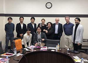 Lisa '00 (center, holding a robot) and her tean representing QUT Design Lab and their Design Robotics Program at a Research conference at University of Tokyo.