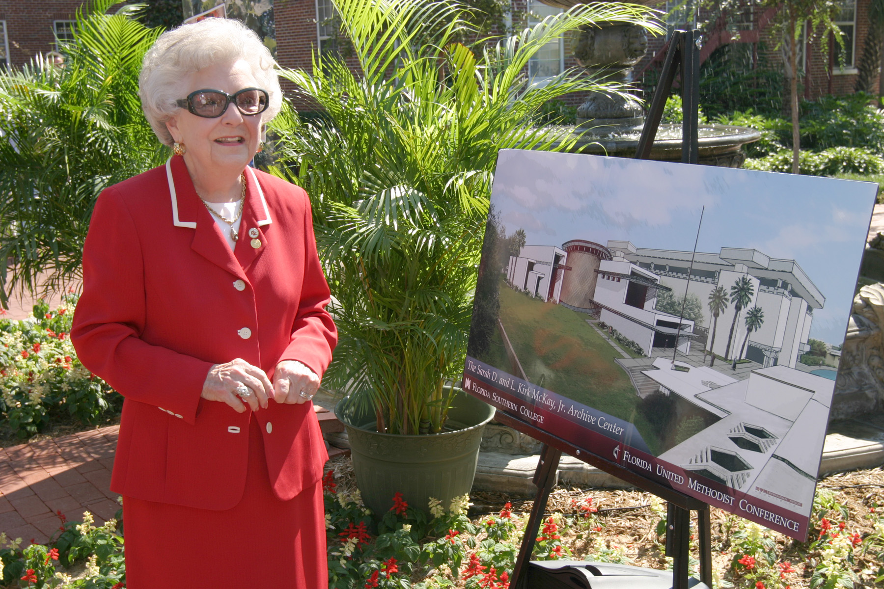 Dr. Sarah D. McKay with plans for the new archive building at FSC