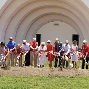 Robert J. Adams and his wife, Ginny, help to break ground for the new Adams Athletic Performance Center.