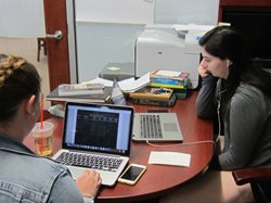 Two students working on laptops