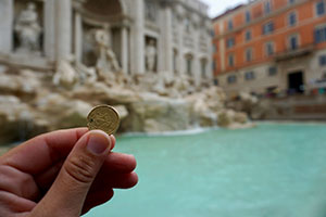 Tossing coins in Treve Fountain in the hopes to make it back to Rome.