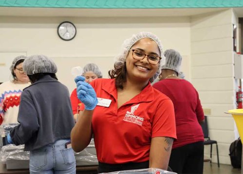 Sophia Francisco '23 packages food at the MLK Days of Impact.