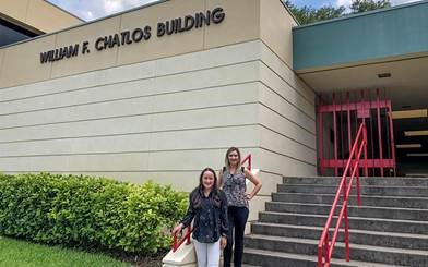  Katherine Stanford ’19 and Tara Johnson ’01 in front of the William F. Chatlos Journalism Building.
