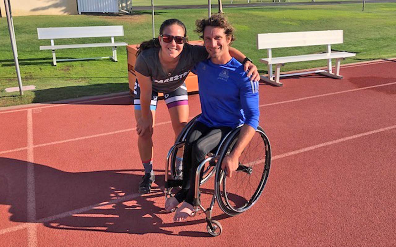 Diana Griessler poses with para athlete Josh George