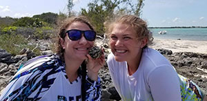 Danielle '21 (left) and McKayla '21 (right) with a West Indian Top Shell snail.