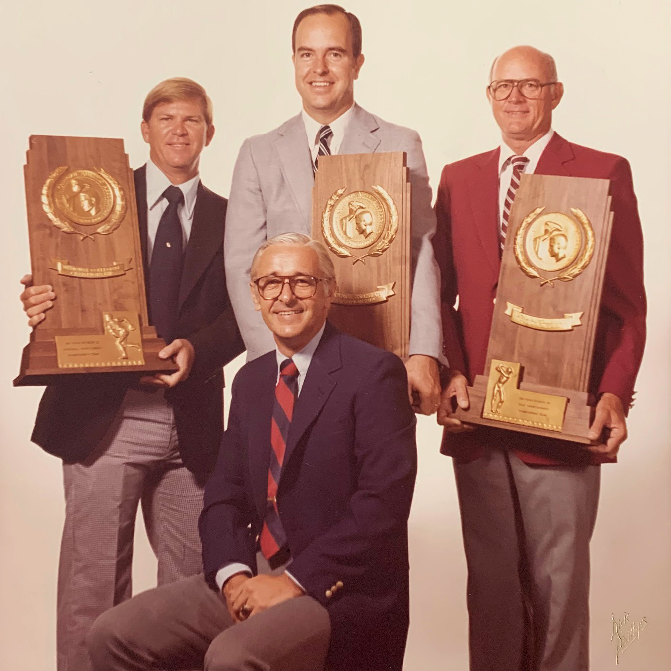 Hal Wissel, Charley Matlock, Joe Arnold, and Hal Smeltzly holding awards