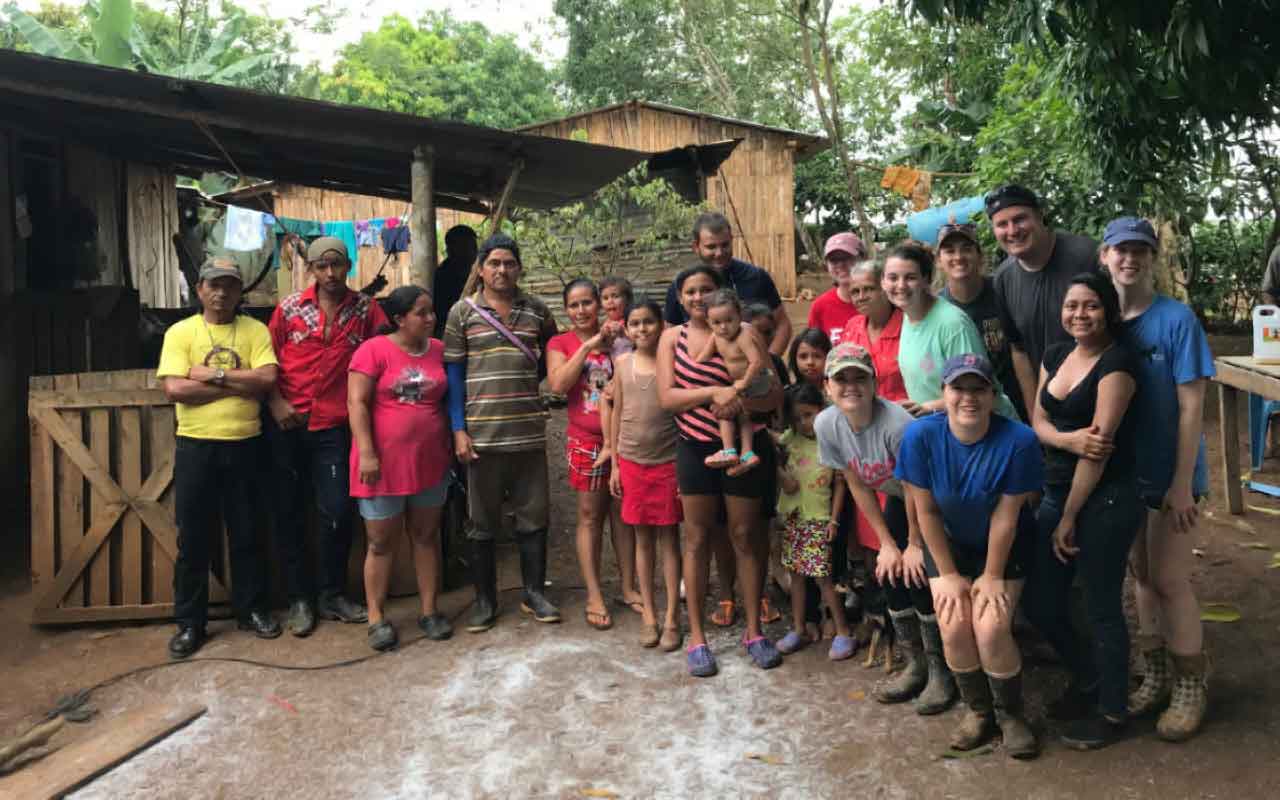 FSC students and the local family they are building a well for.