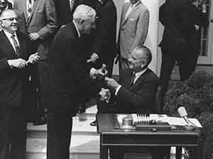 Congressman Haley receives a ceremonial pen from President Johnson