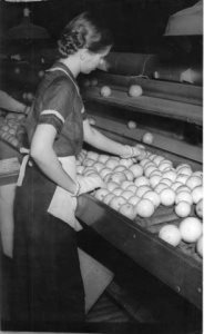 A woman working with oranges