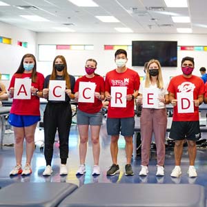 physical therapy students spell out accredited