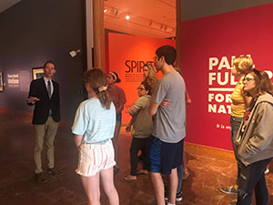 Dr. Rich with his art history class students at the Polk Museum of Art.