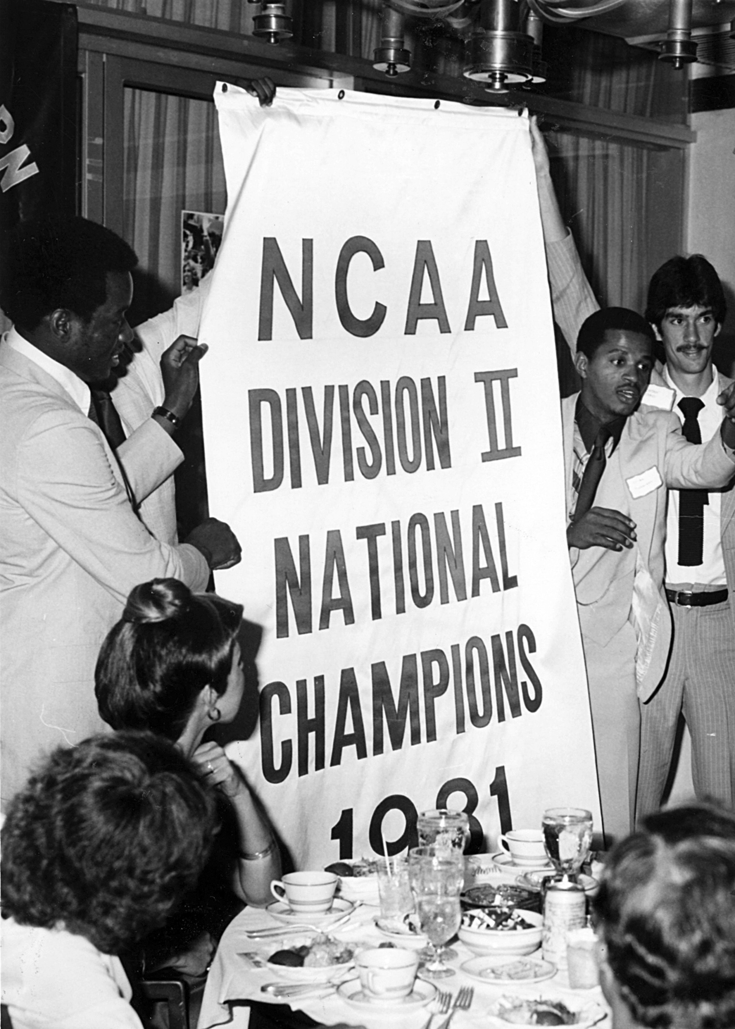 Men's Basketball team with NCAA Division II National Champions 1981 Banner
