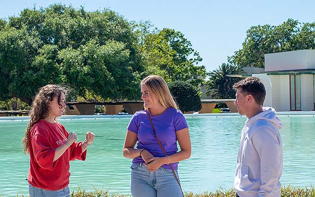 A group of students standing near the waterdome