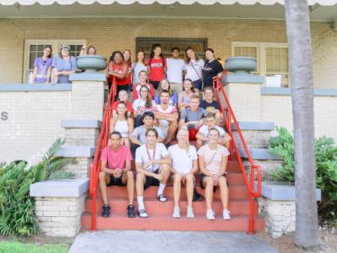 Students sitting on the stairs of the Simmons Multicultural Center