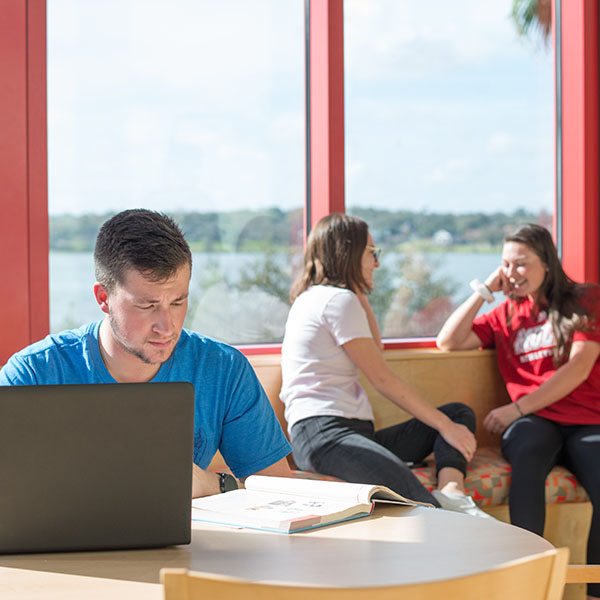 Students studying in a dorm common area